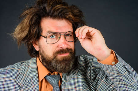 Confused teacher or businessman. School, Education and business concept. Bearded Business man in suit.の写真素材