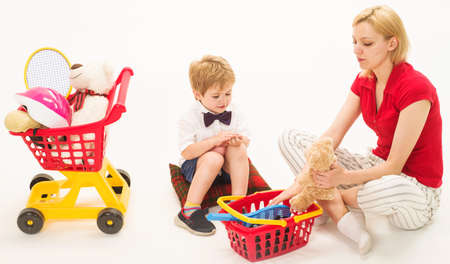 Mother and son playing store. Shopping, discount, sale. Family relationships.の写真素材