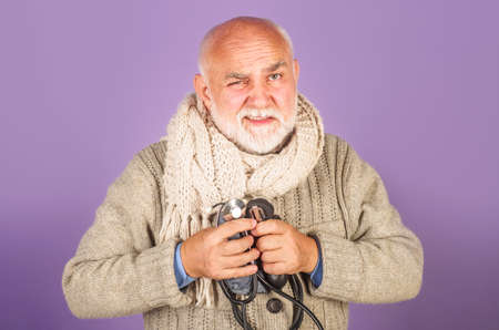 Man with sphygmomanometer. Checking arterial blood pressure. Medical device for measuring pressure.