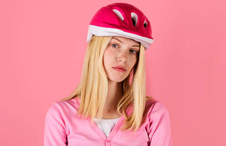 Sport lifestyle. Beautiful woman in cyclist helmet. Blonde girl in biking protective helmet.の写真素材