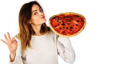 Smiling girl with pizza showing okay sign. Tasty Italian food. Fastfood. Snack. Lunch. Food...