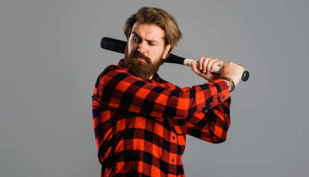 Man swing with baseball bat. Professional baseball player. Sport game. Training, healthy lifestyle.の写真素材