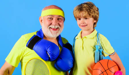 Fitness, active lifestyle. grandfather and grandson sporting. Sports for kids. family time togetherの写真素材