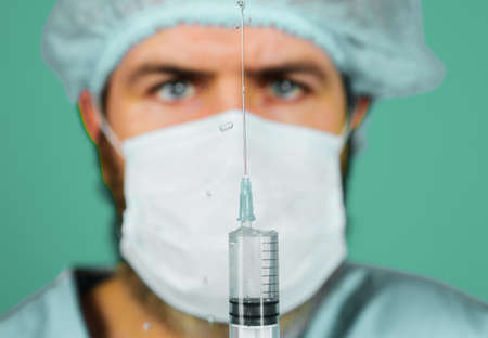 Doctor or nurse with syringe preparing for injection. COVID-19 vaccine. Vaccination and immunizationの写真素材