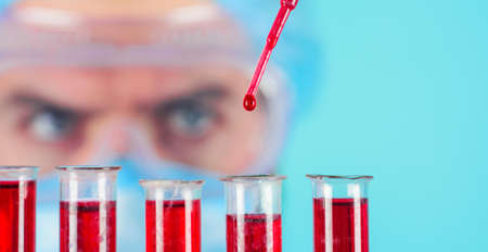 blood test. Laboratory technician, researcher analyzing blood sample. Doctor in laboratory. close upの写真素材