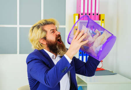 Bearded businessman with trash can. CEO. office worker in suit. leadership. paper recycling conceptの写真素材