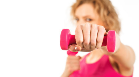 Woman with dumbbell. fitness activities. Workout in the gym. sport equipment. healthy lifestyleの写真素材
