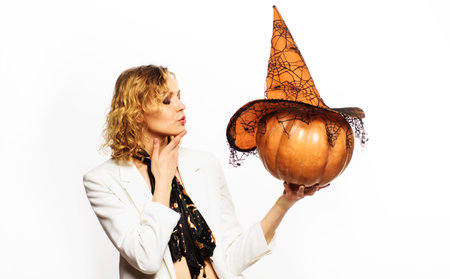 Sensual woman with pumpkin. happy halloween. Trick or treat. Blond girl with Jack-o-lantern. Autumnの写真素材