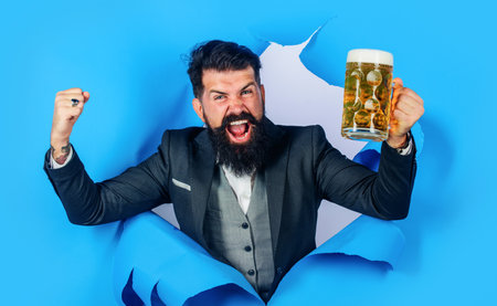 bearded man with mug of beer. Alcohol, traditions, holidays, festival and advertising conceptの写真素材