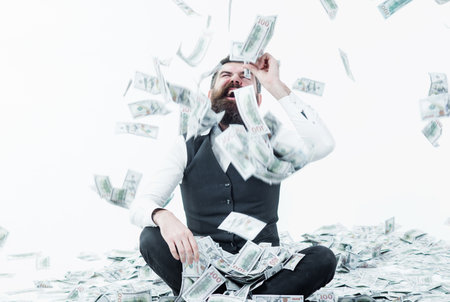 Rich bearded millionaire with banknotes. Businessman excited with money. lottery. bank advertisingの写真素材