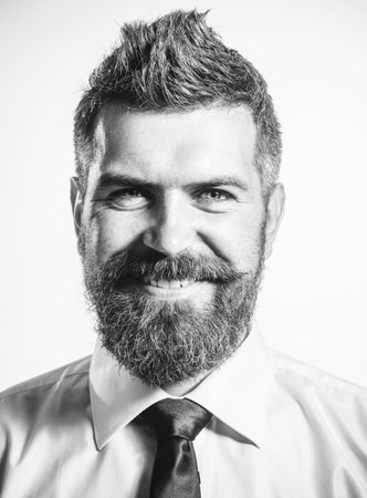 Portrait of smiling business man in stylish shirt and tie. Successful businessman in formal clothing. Handsome bearded man with modern haircut hairdo. Business, fashion and clothing. Black and white.の写真素材