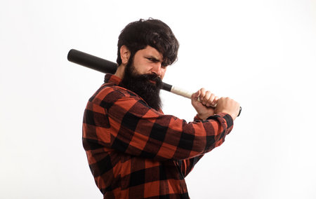 Bearded man with baseball bat. Handsome male in checkered shirt with baseball bat. Sport equipment. Serious bearded man in plaid shirt ready for training. Baseball player with bat. Healthy lifestyleの写真素材