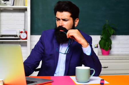 Pensive student preparing for exam or test at university. Learning, education. Thoughtful male...