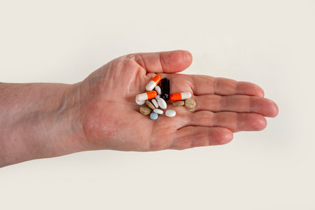 Pills in hand for pharmacy purchase. Pills as medicine for medical treatment. Pills in blister for...