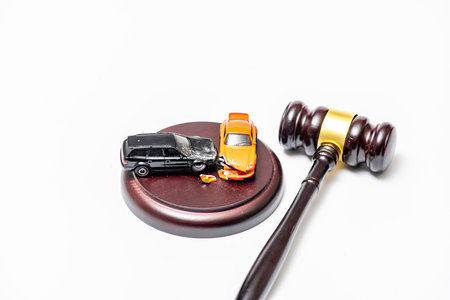 Gavel in traffic court for regulation. Car in traffic court for speeding. Gavel for prosecution in...