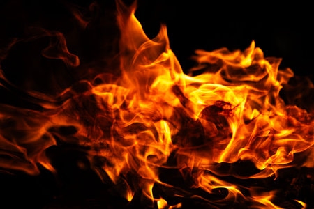 Fire flame background. Fire burning energy concept. Fire intense motion. Fire dramatic glow effect.