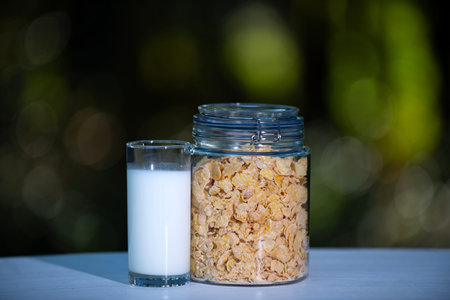 Cereal in morning. Cereal breakfast. Cereal with milk for healthy food. Cereal from grains. Granola in jar for healthy eating. Granola with milk for protein nutrition. Granola from whole grain.の写真素材