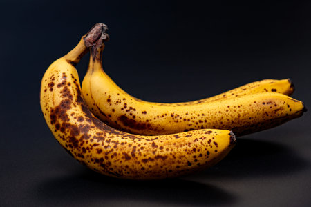 Banana overripe fruit texture. Banana close up surface. Banana raw ingredient for smoothies. Banana natural food.の写真素材