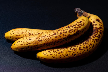 Banana macro texture with spots. Banana closeup food surface. Banana natural dessert ingredient. Banana fresh fruit.の写真素材