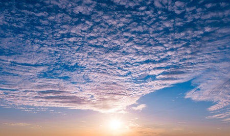 Sunset on dramatic clouds. Sunset sunlight in sky. Sunset radiant summer. Sunset solar horizon.