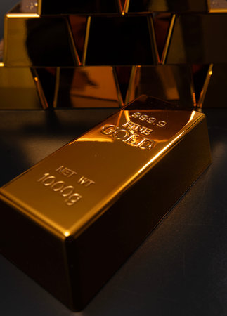 Gold bullion. Gold bar studio background. Metal gold texture. Gold and banking concepts.