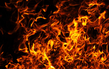 Fire flame background. Fire burning energy concept. Fire intense motion. Fire dramatic glow effect.