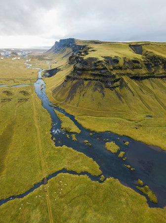 Aerial view of a river flowing through a valley in Iceland.の写真素材