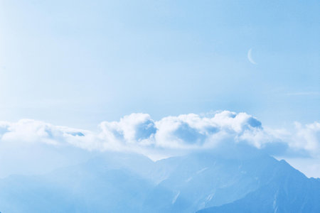 mountains and clouds in the blue sky, photo as a background, digital image