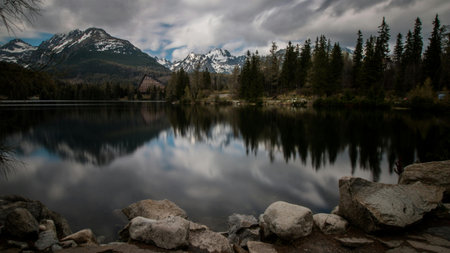 Reflection of mountains and clouds in a lake, Canadian Rockies, Alberta, Canadaの写真素材
