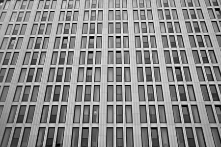 Modern office building detail. Black and white. Architectural background.