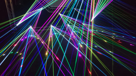 Colorful laser show in the night club, closeup of photo