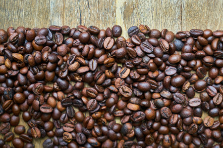 Coffee beans on wooden background, can be used as a background