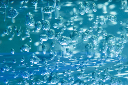 Bubbles in the water on a blue background close-up