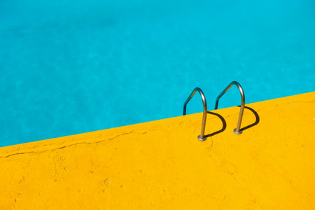 Swimming pool with two swimming trunks in yellow and blue colors