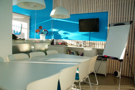 Interior of a modern office, meeting room with table and chairs