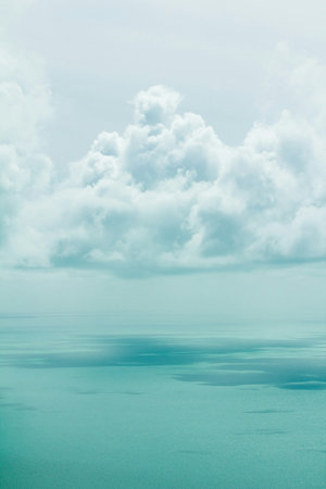 Blue sky with white clouds and water surface. Abstract natural background.