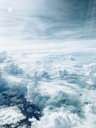 Aerial view of clouds in the sky. View from airplane window