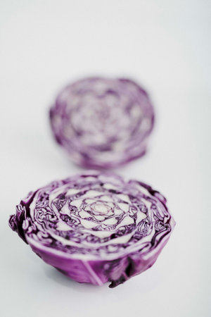 Purple cabbage on white background. Shallow depth of field.