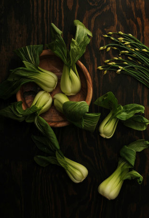 Bok choy (chinese cabbage) on dark wooden backgroundの写真素材