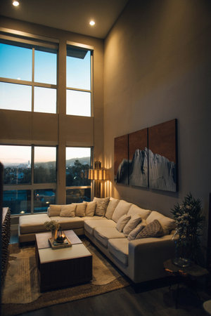Luxury living room interior design with a large window overlooking the city