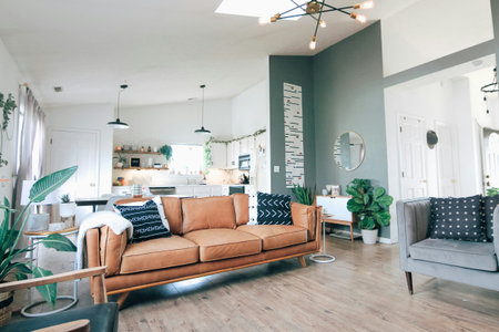 Modern living room interior with sofa, coffee table and plants. Nobody inside
