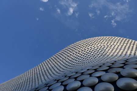 3D render of a modern architecture background with blue sky and white clouds