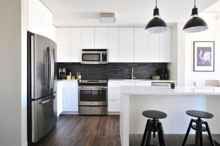 interior of modern kitchen with black and white furniture, nobody inside