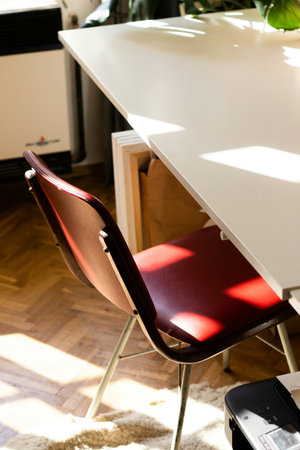 Table and chair in the living room at home. Home office.