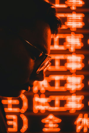 Portrait of a young man with glasses against the background of numbers