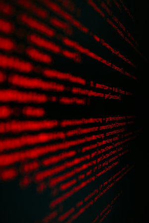 Computer program code on a dark background. Close-up. The concept of programming and coding.