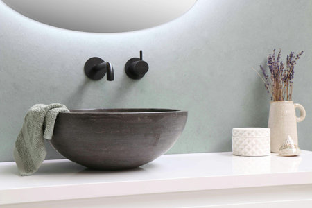 Bathroom interior with bathtub and towel.