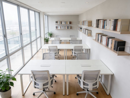 Interior of a modern office with white walls, wooden floor and rows of bookshelves