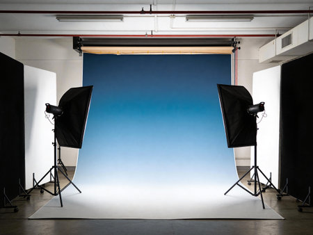 Photo studio with lighting equipment and blue background. Ready for photo shootingの写真素材
