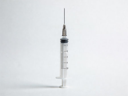 Medical syringe on a white background. The concept of vaccination.